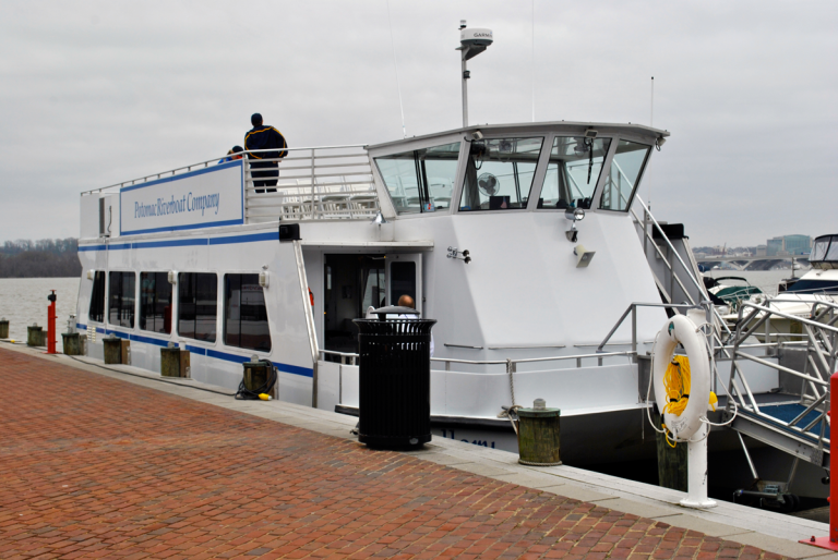 Commuter ferry service at waterfront floats onward